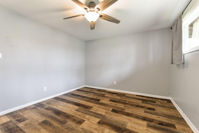 3434 Fishinger Rd, Columbus, OH 43221 - unfurnished room featuring baseboards, dark wood-style floors, and ceiling fan