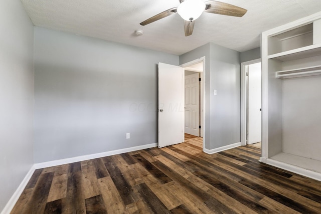 3434 Fishinger Rd, Columbus, OH 43221 - unfurnished bedroom featuring baseboards, a ceiling fan, dark wood-type flooring, and a closet