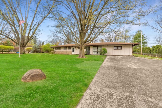 3434 Fishinger Rd, Columbus, OH 43221 - ranch-style house with a front lawn, fence, and driveway