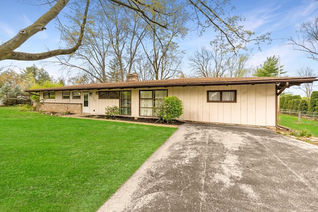 3434 Fishinger Rd, Columbus, OH 43221 - view of front of property featuring fence, driveway, a chimney, and a front yard