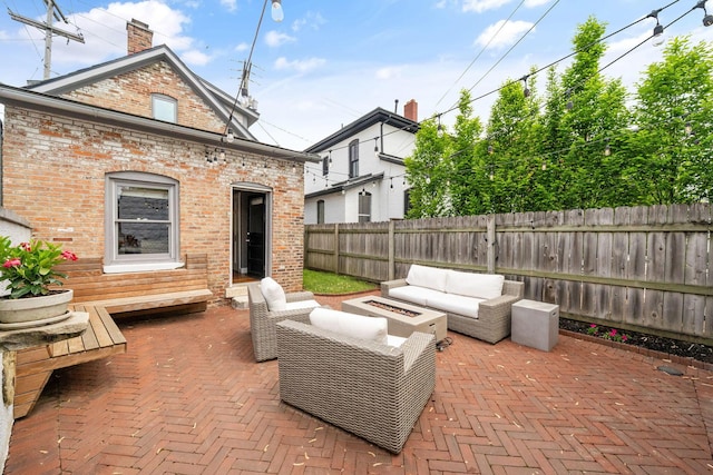 129 Jackson St, Columbus, OH 43206 - view of patio featuring an outdoor living space with a fire pit and a fenced backyard