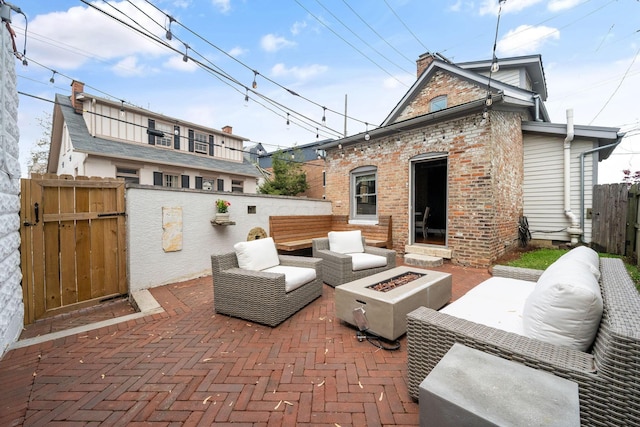129 Jackson St, Columbus, OH 43206 - view of patio / terrace with a gate, fence, and an outdoor living space with a fire pit