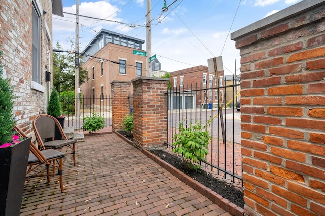 129 Jackson St, Columbus, OH 43206 - view of patio / terrace with fence and a gate