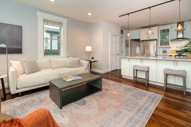 129 Jackson St, Columbus, OH 43206 - living area with dark wood-style flooring, recessed lighting, and baseboards