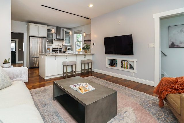 129 Jackson St, Columbus, OH 43206 - living area with dark wood finished floors, baseboards, and recessed lighting