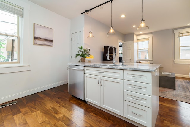 129 Jackson St, Columbus, OH 43206 - kitchen with dishwasher, a sink, dark wood-style floors, white cabinets, and baseboards
