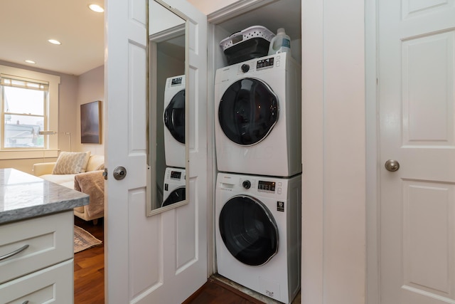 129 Jackson St, Columbus, OH 43206 - laundry room featuring estacked washer and dryer, dark wood-style floors, and recessed lighting