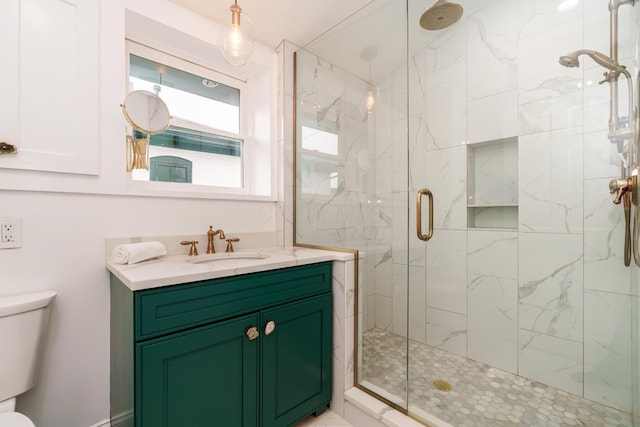 129 Jackson St, Columbus, OH 43206 - full bathroom featuring a marble finish shower, toilet, and vanity