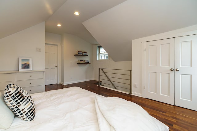 129 Jackson St, Columbus, OH 43206 - bedroom featuring dark wood-type flooring, lofted ceiling, baseboards, recessed lighting, and a closet