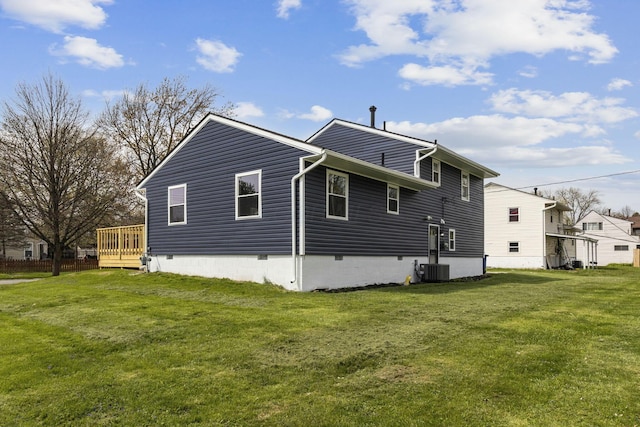 view of side of home with a yard and cooling unit