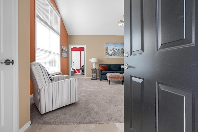 interior space featuring baseboards and carpet floors