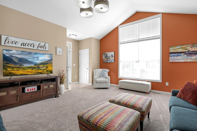 living room featuring carpet floors, a chandelier, vaulted ceiling, and baseboards