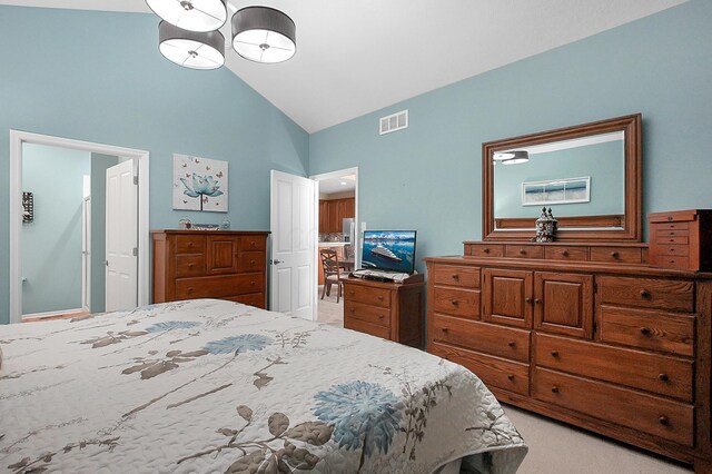 bedroom with high vaulted ceiling, light carpet, and visible vents