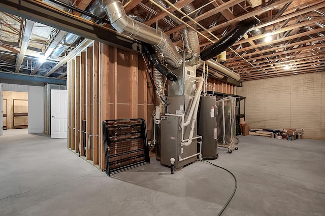 unfinished basement featuring heating unit and electric water heater