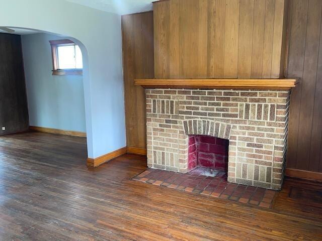 847 S Eureka Ave, Columbus, OH 43204 - interior details featuring arched walkways, a brick fireplace, wood finished floors, and baseboards