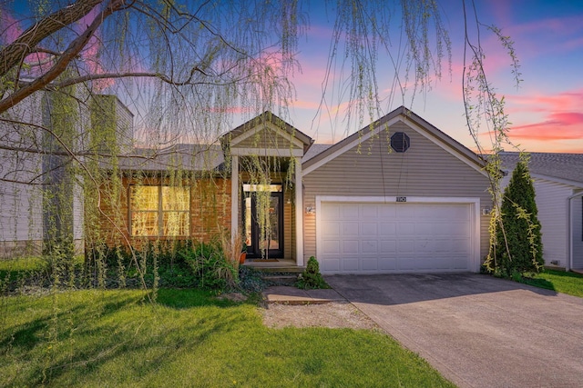 1145 Rendezvous Ln, Columbus, OH 43207 - ranch-style house featuring a front yard, concrete driveway, and an attached garage