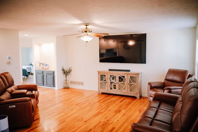 17920 Miller Rd, Richwood, OH 43344 - living area featuring baseboards, a ceiling fan, wood finished floors, and visible vents