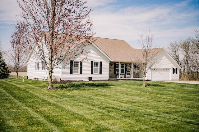 17920 Miller Rd, Richwood, OH 43344 - view of front of house featuring a front lawn, a garage, concrete driveway, and covered porch