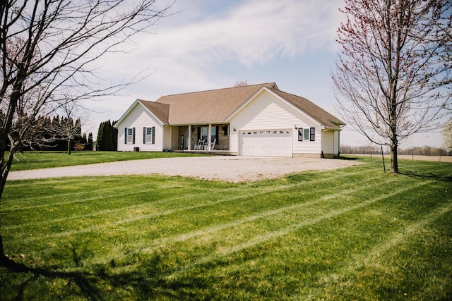 17920 Miller Rd, Richwood, OH 43344 - view of front of house with an attached garage, a porch, a front lawn, and driveway