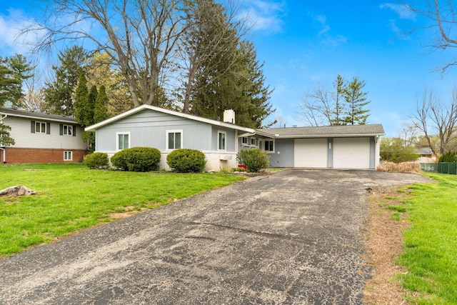 3318 Darbyshire Dr, Hilliard, OH 43026 - ranch-style home with a chimney, driveway, a front yard, and a garage