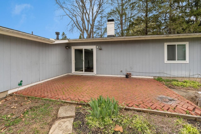 3318 Darbyshire Dr, Hilliard, OH 43026 - rear view of property featuring a chimney and a patio