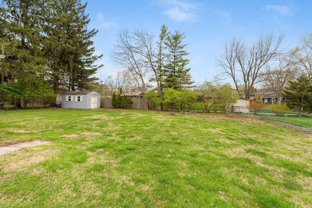 3318 Darbyshire Dr, Hilliard, OH 43026 - view of yard with a fenced backyard, an outbuilding, and a storage unit