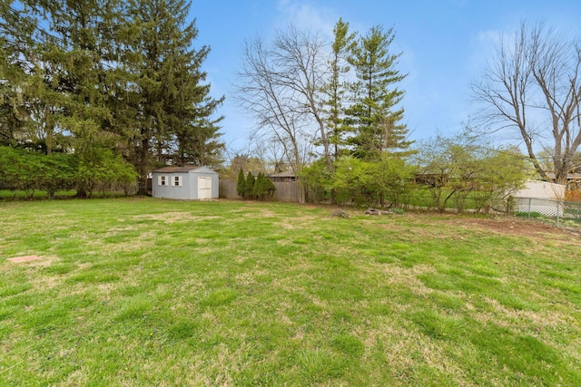 3318 Darbyshire Dr, Hilliard, OH 43026 - view of yard featuring a storage unit, an outbuilding, and a fenced backyard