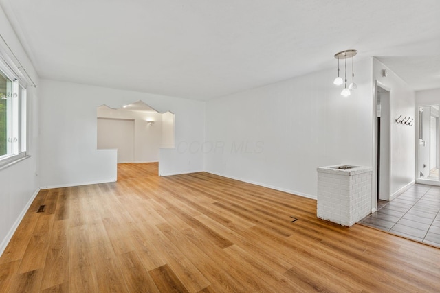 3318 Darbyshire Dr, Hilliard, OH 43026 - unfurnished living room with visible vents, light wood finished floors, and baseboards