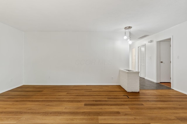 3318 Darbyshire Dr, Hilliard, OH 43026 - unfurnished room with baseboards, wood finished floors, and visible vents