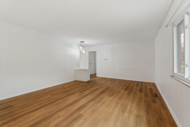 3318 Darbyshire Dr, Hilliard, OH 43026 - unfurnished room with wood finished floors, baseboards, and plenty of natural light