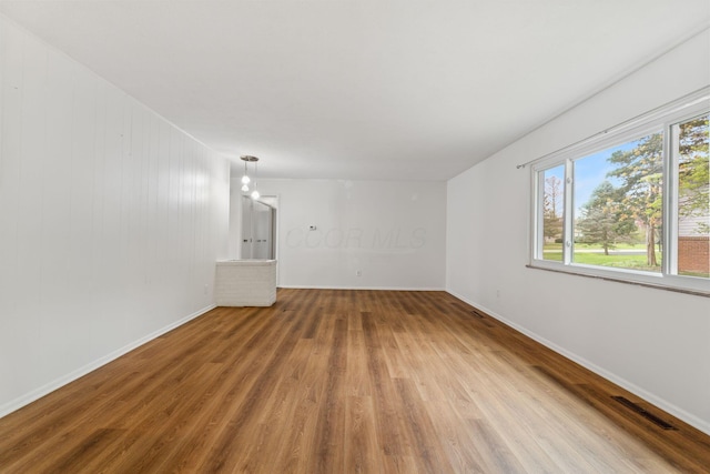 3318 Darbyshire Dr, Hilliard, OH 43026 - spare room with baseboards, wood finished floors, and visible vents