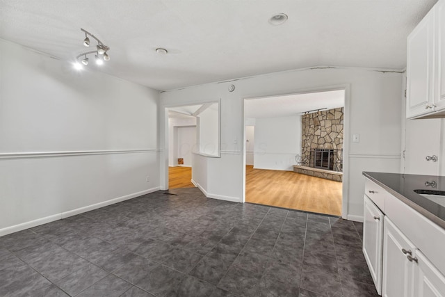 3318 Darbyshire Dr, Hilliard, OH 43026 - interior space featuring dark tile patterned floors, baseboards, and a fireplace