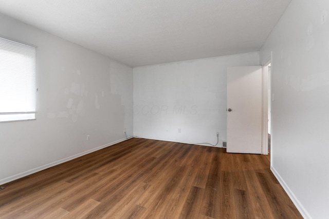 3318 Darbyshire Dr, Hilliard, OH 43026 - empty room with baseboards and wood finished floors