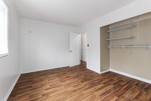 3318 Darbyshire Dr, Hilliard, OH 43026 - unfurnished bedroom with baseboards, wood finished floors, and a closet