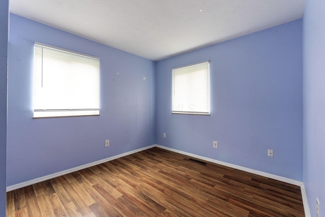 3318 Darbyshire Dr, Hilliard, OH 43026 - unfurnished room featuring wood finished floors, visible vents, and baseboards