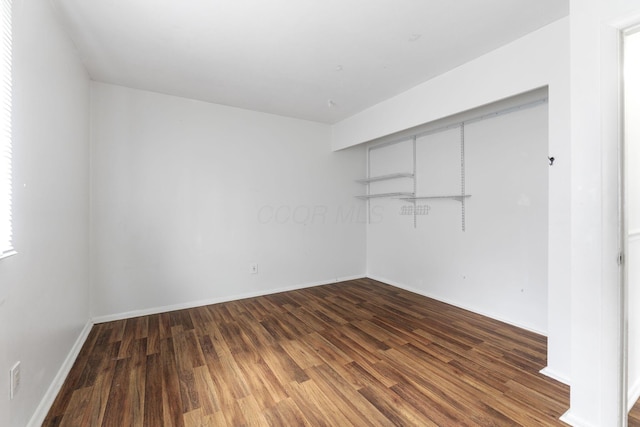3318 Darbyshire Dr, Hilliard, OH 43026 - unfurnished bedroom featuring wood finished floors and baseboards