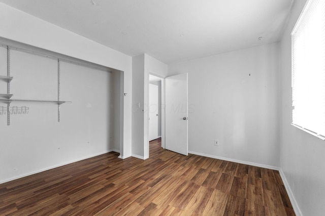 3318 Darbyshire Dr, Hilliard, OH 43026 - unfurnished bedroom featuring wood finished floors, a closet, and baseboards