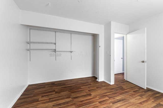 3318 Darbyshire Dr, Hilliard, OH 43026 - unfurnished bedroom with baseboards, wood finished floors, and a closet