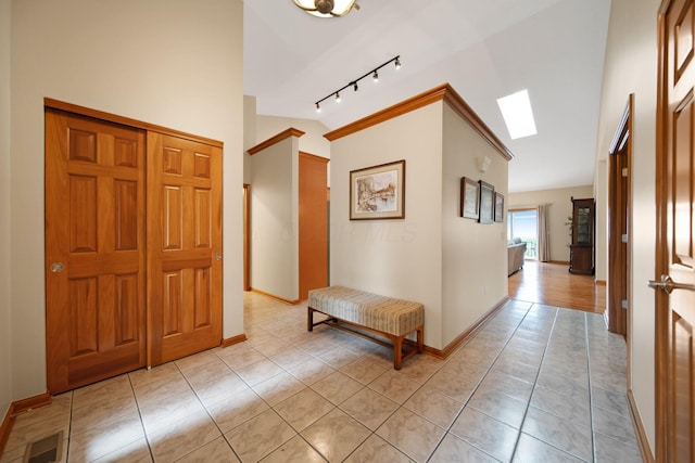 2882 Kool Air Way, Columbus, OH 43231 - foyer with a skylight, light tile patterned floors, track lighting, baseboards, and visible vents