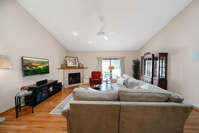 2882 Kool Air Way, Columbus, OH 43231 - living room featuring high vaulted ceiling, a ceiling fan, light wood-style flooring, a fireplace, and recessed lighting