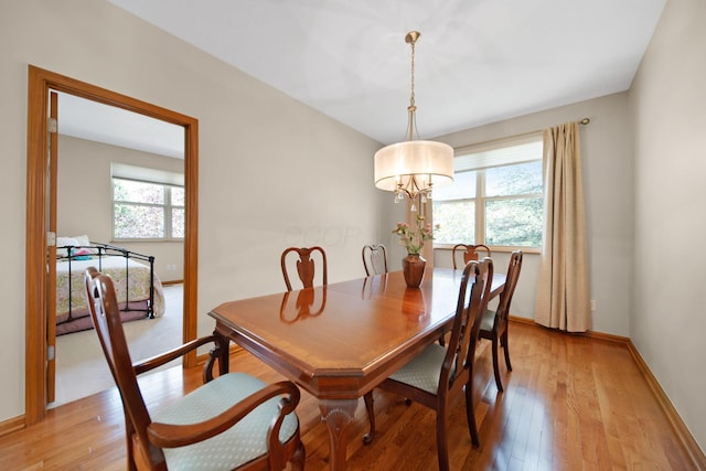2882 Kool Air Way, Columbus, OH 43231 - dining area featuring a healthy amount of sunlight, a chandelier, and light wood-style floors
