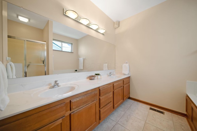 2882 Kool Air Way, Columbus, OH 43231 - full bath featuring a sink, a stall shower, double vanity, baseboards, and visible vents