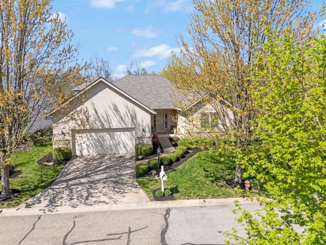 2882 Kool Air Way, Columbus, OH 43231 - view of front of house featuring a garage, stucco siding, a front lawn, and concrete driveway