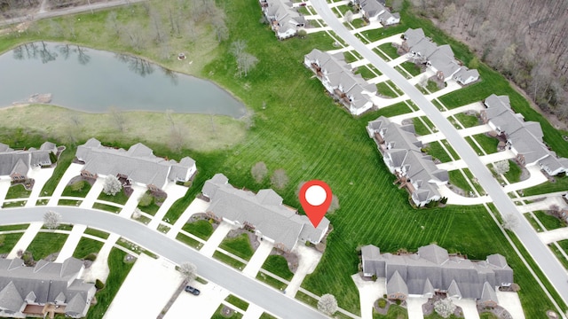 aerial view featuring a residential view and a water view