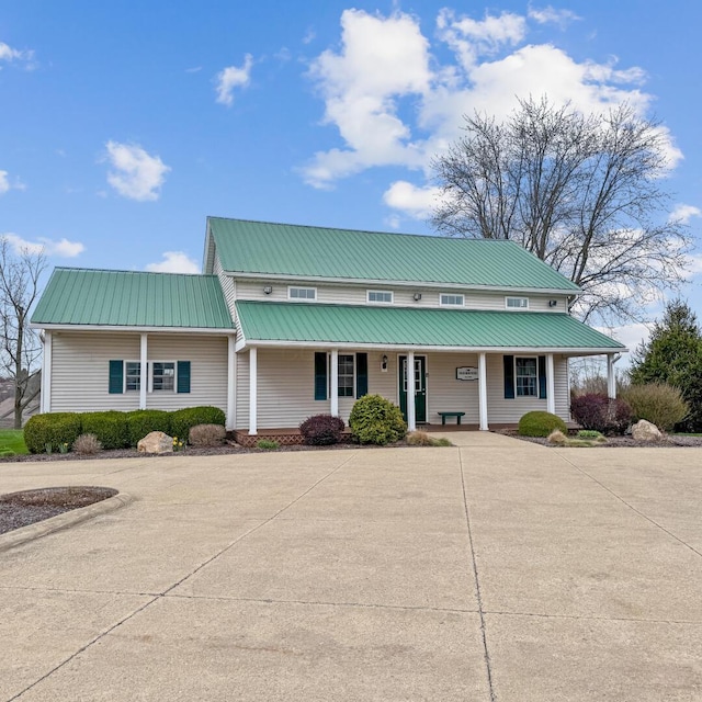 view of front of house with metal roof and covered porch