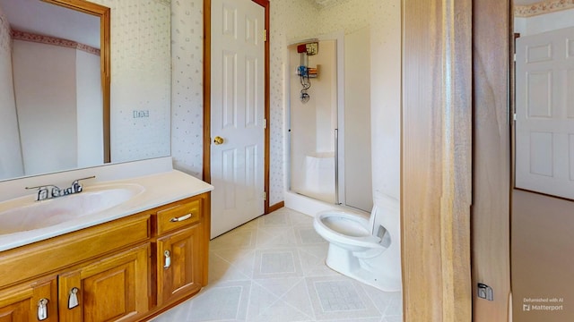 full bath with a shower stall, toilet, vanity, and wallpapered walls