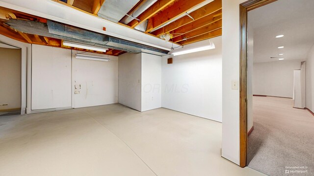 finished basement featuring recessed lighting