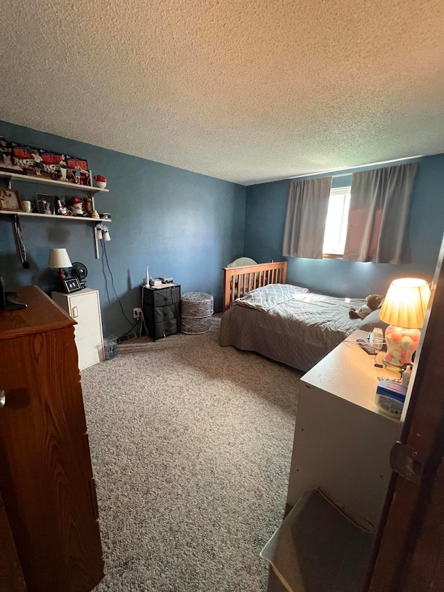 carpeted bedroom with a textured ceiling