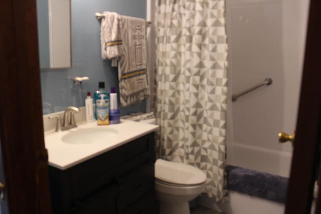 full bath with toilet and vanity