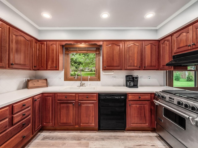 4159 Rowanne Rd, Columbus, OH 43214 - kitchen featuring dishwasher, a sink, high end stainless steel range oven, under cabinet range hood, and light countertops